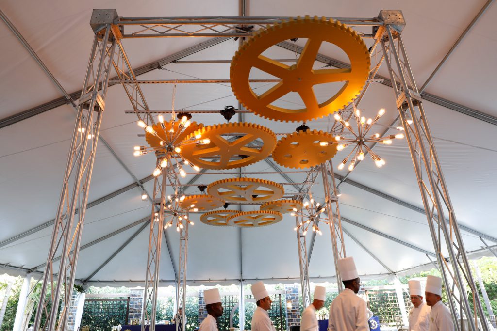 Gear and lights display above chef station on terrace