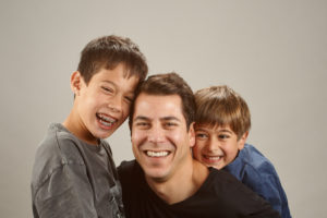 Family photo of boys and father