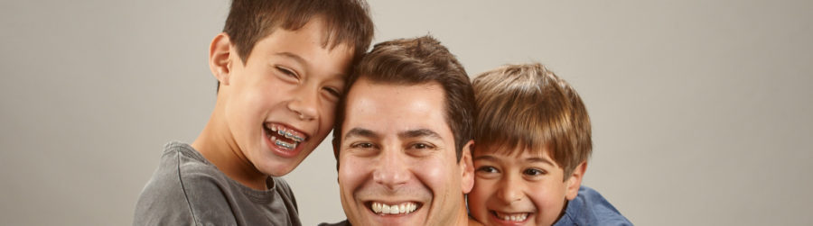 Family photo of boys and father